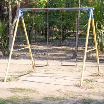 Metal swing set in need of swing set removal services