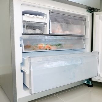 Old freezer in need of appliance removal services